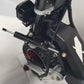 Close-up of a black Rooder steering damper installed on the front fork of a Glidezone GD83 electric scooter.