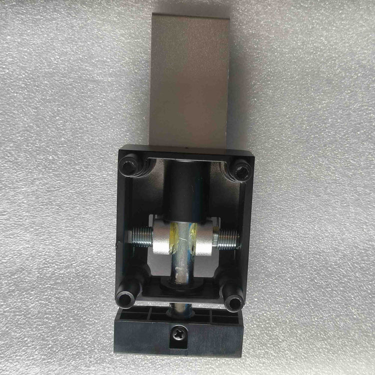 Underside view of the automatic kickstand replacement part for Rooder X60 Plus electric scooter, displaying the black plastic housing, hinge pin mechanism with grease, and a bottom cross-head screw.